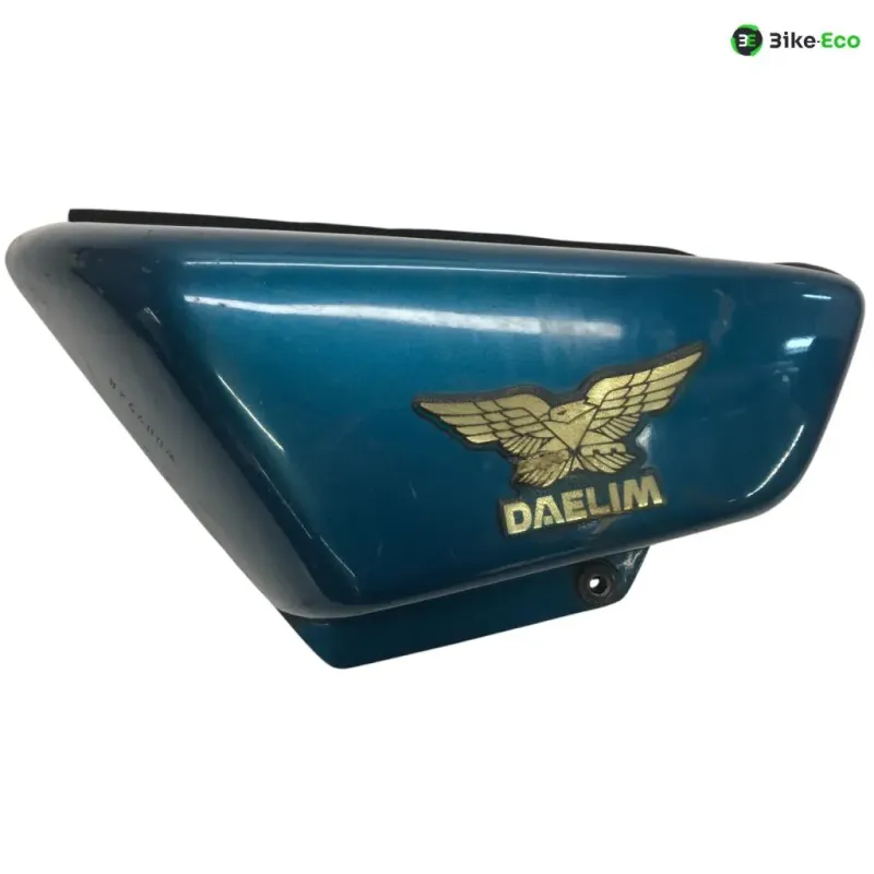 Cache carenage sous selle gauche DAELIM VT 125 1999-2004